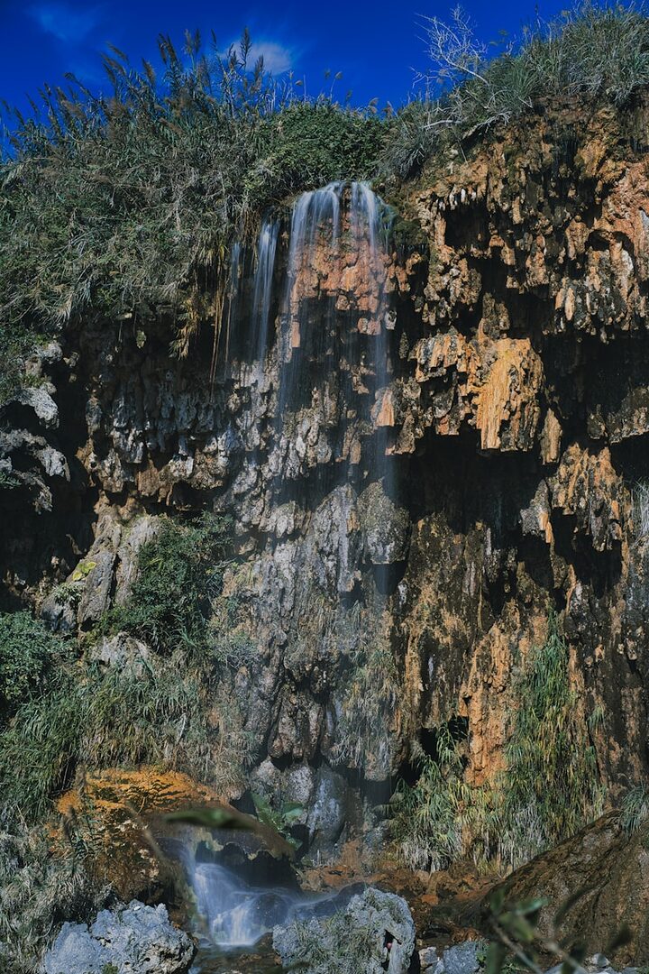 a large waterfall with a bunch of water coming out of it
